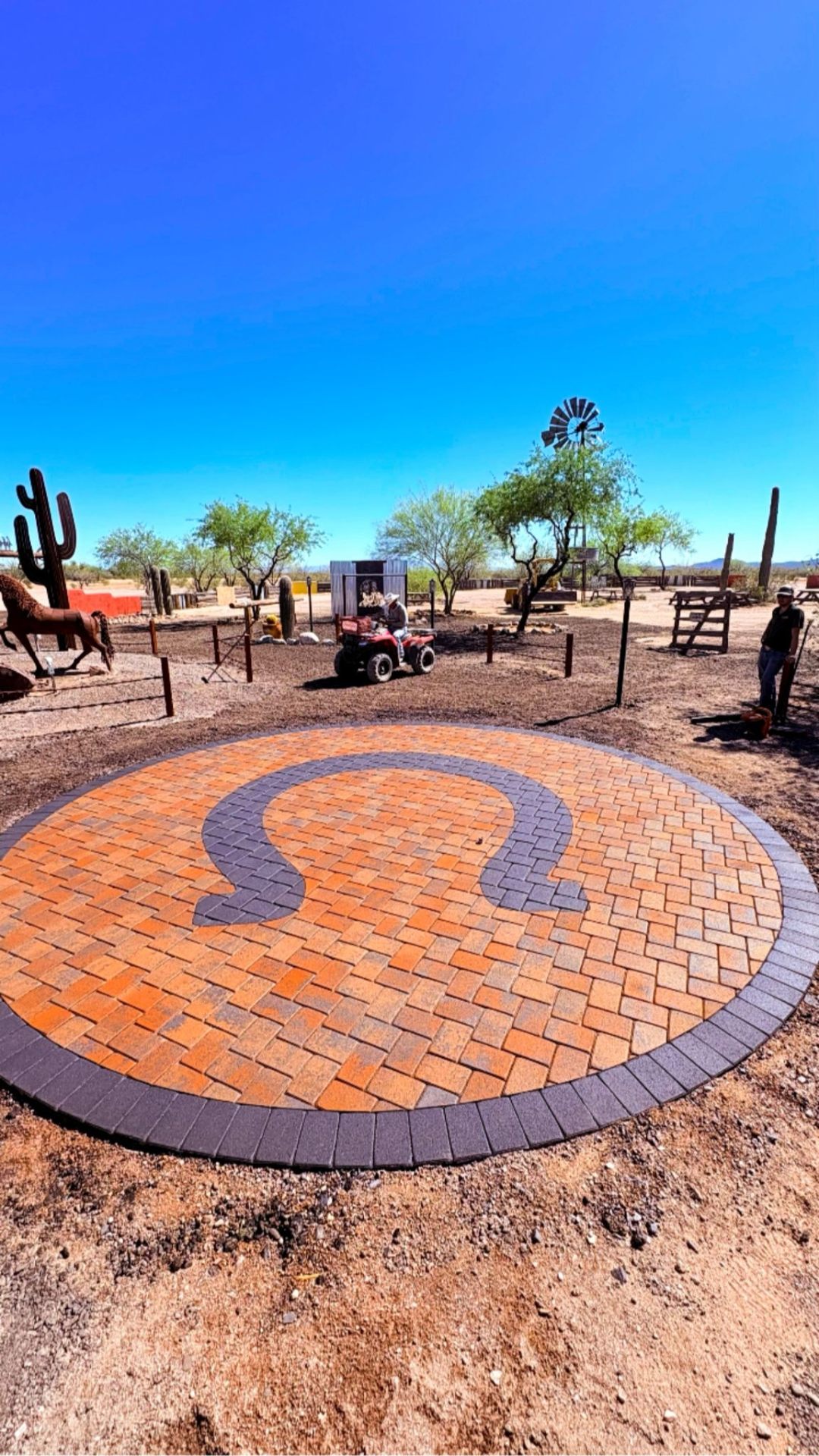 Circular yin-yang paver design in Arizona desert
